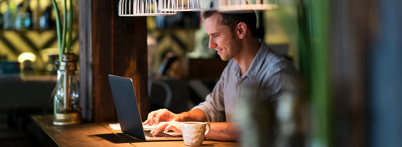 Man Working in Cafe